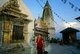Nepal: Monk circumambulates the main stupa, Swayambhunath (Monkey Temple), Kathmandu Valley